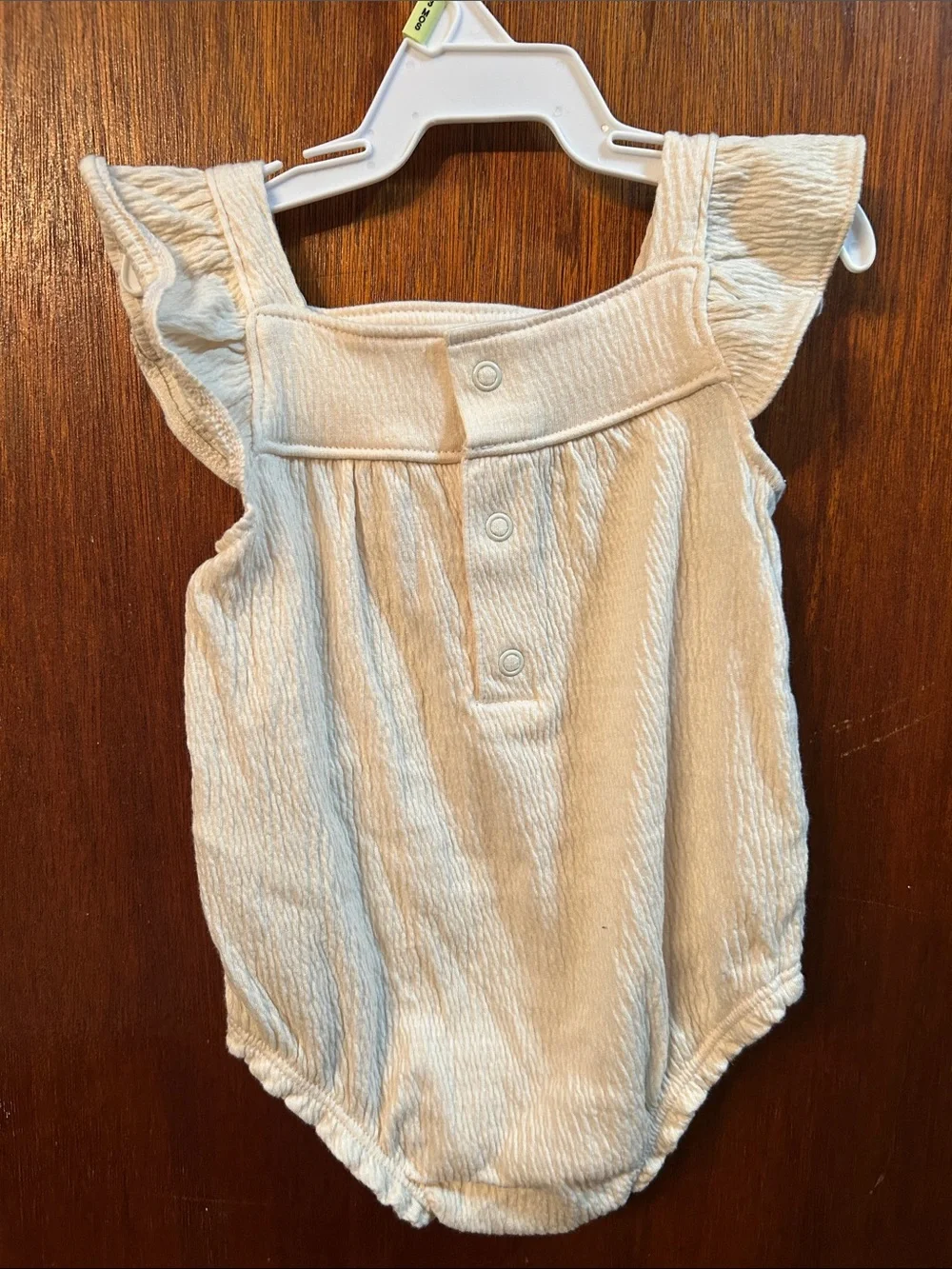 Cream Ruffle-Sleeve Baby One-Piece with Dark Grey Floral Embroidery